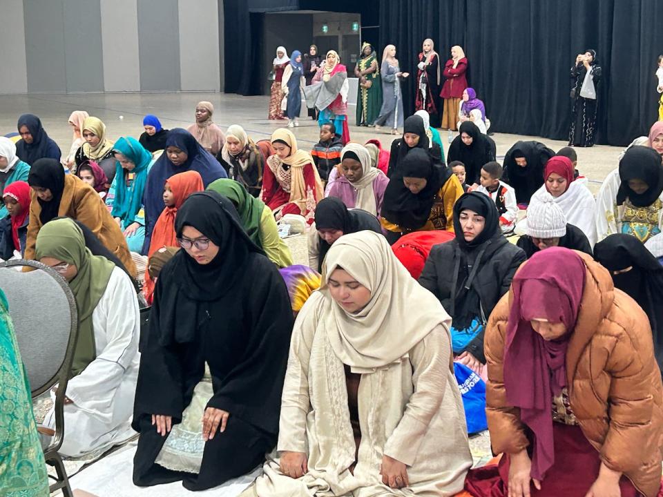 People pray during Eid al-Fitr at Winnipeg's RBC Convention Centre on Wednesday morning.