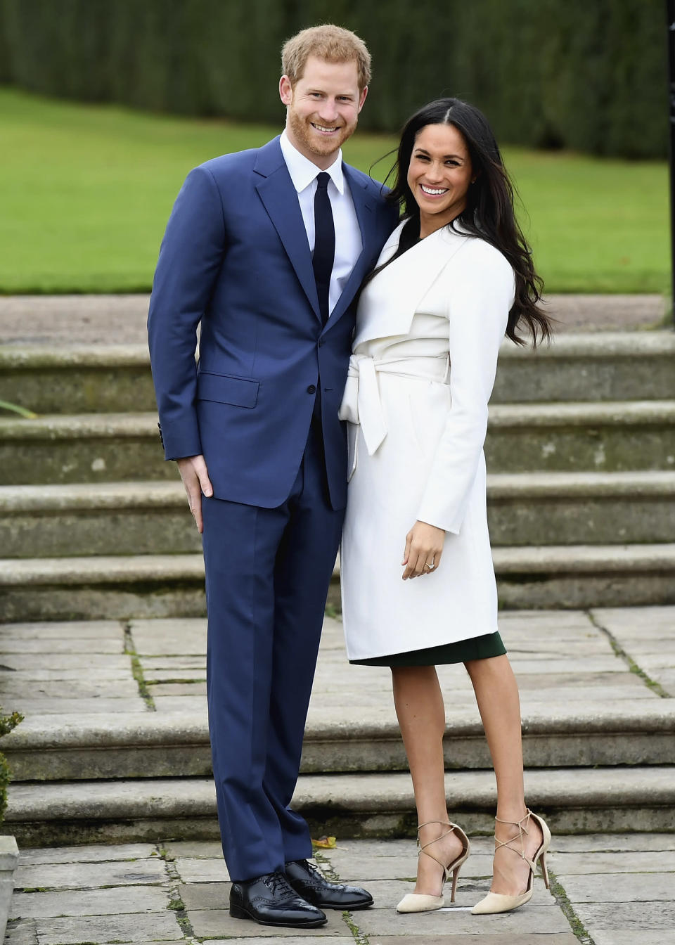 <p>On Nov. 27, it was announced that <a rel="nofollow" href="https://www.yahoo.com/lifestyle/tagged/Prince-Harry/" data-ylk="slk:Prince Harry" class="link rapid-noclick-resp">Prince Harry</a> and <a rel="nofollow" href="https://www.yahoo.com/lifestyle/tagged/Meghan-Markle/" data-ylk="slk:Meghan Markle" class="link rapid-noclick-resp">Meghan Markle</a> are engaged. The royal was asked by reporters during the photo op whether the proposal was romantic. “Of course it was,” he <a rel="nofollow" href="https://www.yahoo.com/lifestyle/britains-prince-harry-says-thrilled-engagement-u-actress-141429669.html" data-ylk="slk:replied;outcm:mb_qualified_link;_E:mb_qualified_link;ct:story;" class="link rapid-noclick-resp yahoo-link">replied</a>. (Photo: Getty Images) </p>