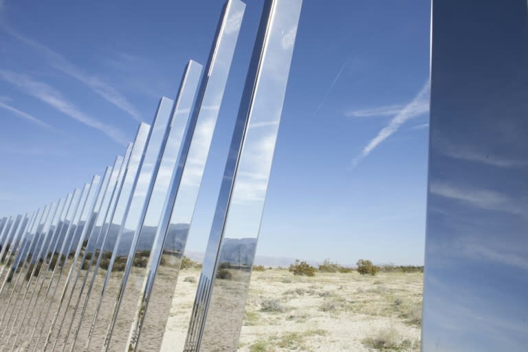 Phillip K Smith planted 300 angled, vertical mirrored posts called "The Circle of Land and Sky" for the Desert X exhibit in the Coachella Valley of California