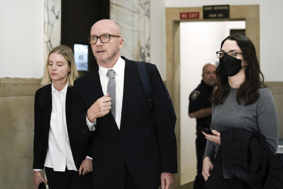 Film director Paul Haggis exits the courtroom for a lunch break, Wednesday, Oct. 19, 2022, in New York. Jurors are getting their first look at a lawsuit that pits Oscar-winning moviemaker Haggis against a publicist who alleges that he raped her. He says their 2013 encounter was consensual. (AP Photo/Julia Nikhinson)