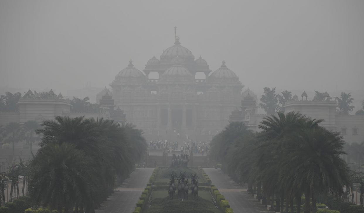 <span class="caption">Much of India experiences both extreme heat and extreme air pollution, as seen in this photo of the Akshardham Hindu temple. Days with both are going to increase. </span> <span class="attribution"><a class="link " href="https://www.gettyimages.com/detail/news-photo/general-view-of-the-akshardham-hindu-temple-under-heavy-news-photo/1182232711?adppopup=true" rel="nofollow noopener" target="_blank" data-ylk="slk:Sajjad Hussain/AFP via Getty Images;elm:context_link;itc:0;sec:content-canvas">Sajjad Hussain/AFP via Getty Images</a></span>