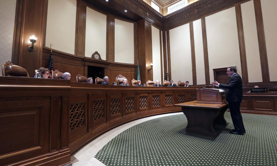 Paul J. Lawrence, attorney for the Legislature, addresses justices during a hearing before the Washington Supreme Court Tuesday, June 11, 2019, in Olympia, Wash. The court heard oral arguments in the case that will determine whether state lawmakers are subject to the same disclosure rules that apply to other elected officials under the voter-approved Public Records Act. The hearing before the high court was an appeal of a case that was sparked by a September 2017 lawsuit filed by a media coalition, led by The Associated Press. (AP Photo/Elaine Thompson)