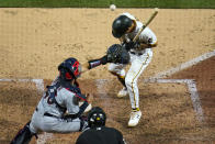 Pittsburgh Pirates' Adam Frazier, right, is hit by a pitch from Cleveland Indians reliever Kyle Nelson, forcing in a run during the sixth inning of a baseball game in Pittsburgh, Friday, June 18, 2021. (AP Photo/Gene J. Puskar)