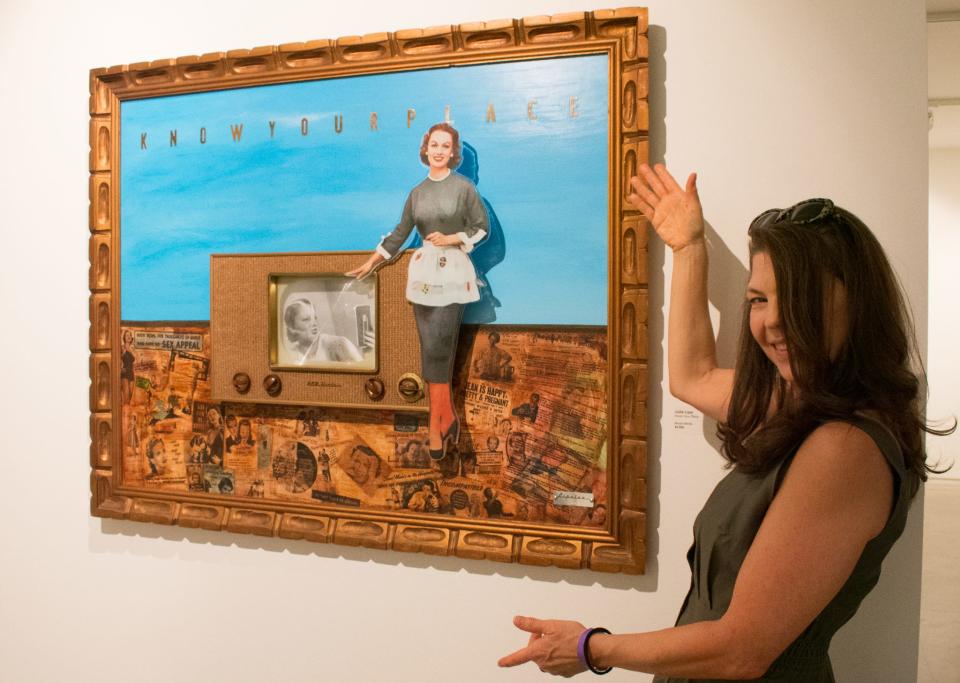 Julie Lipa poses with her artwork "Know Your Place" during the  2022 ACE Exhibition and Sale at the Artists Center at the Galen in Palm Desert, Calif. on Feb 11, 2022.