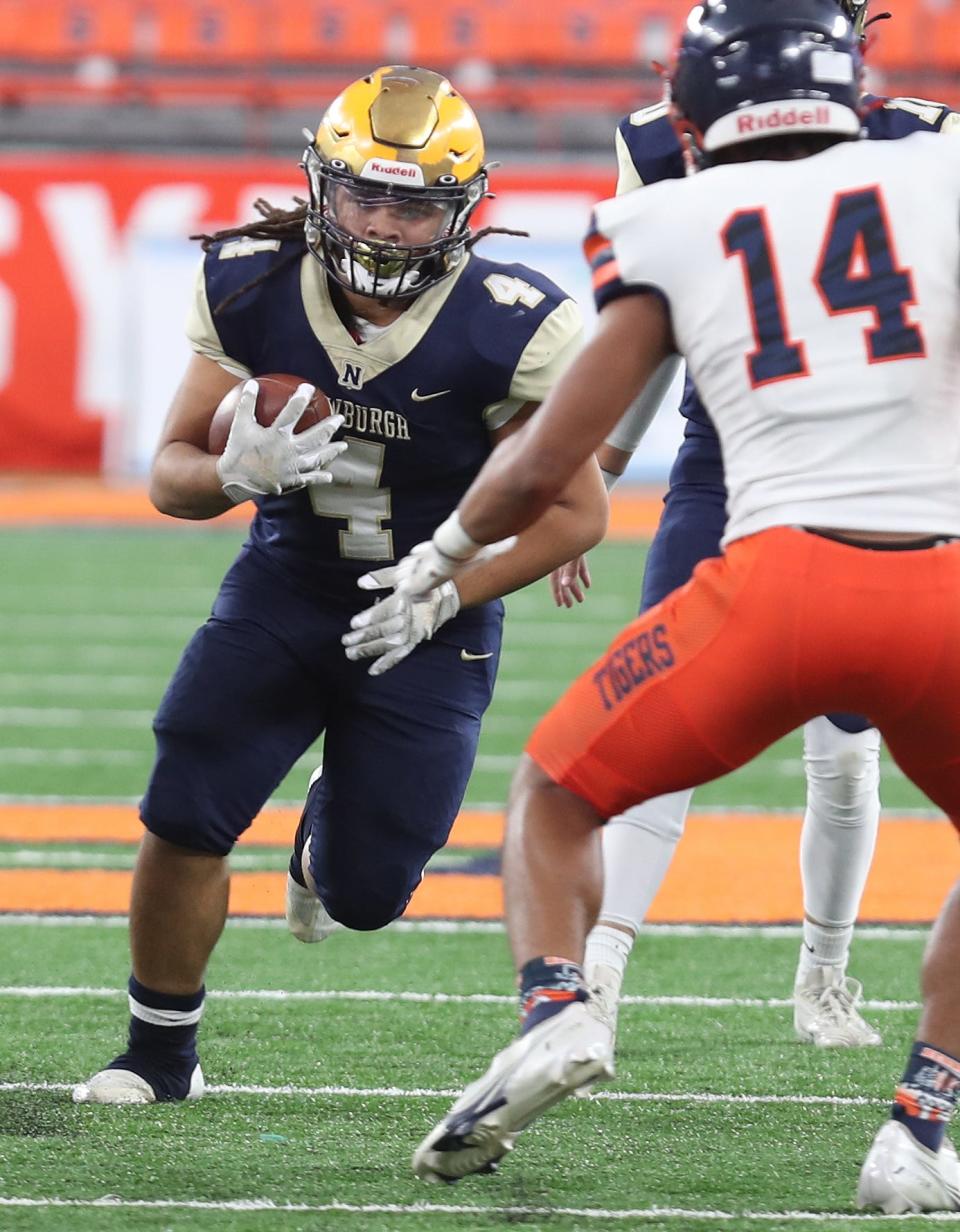 Newburgh's Tajir Walker (4) looks for some running room in the Bennett defense during the state Class AA football championship at JMA Wireless Dome in Syracuse Dec. 4, 2022. 