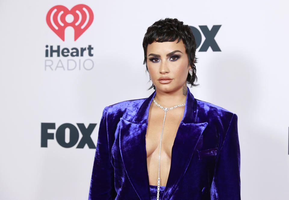 Singer Demi Lovato, 29, revealed a large spider tattoo on the side of their head on Saturday. (Photo: Emma McIntyre/Getty Images for iHeartMedia)