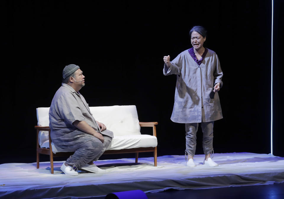 An actor and an actress perform the stage play "May 35th" in Taipei, Taiwan, Thursday, June 1, 2023. This Sunday, June 4, 2023 will mark the 34th anniversary of China's 1989 crackdown on pro-democracy protesters at Beijing's Tiananmen Square. Though local commemoration appeared to be muted, many members of the Hong Kong diaspora are committed to keeping the flames alive overseas. (AP Photo/Chiang Ying-ying)