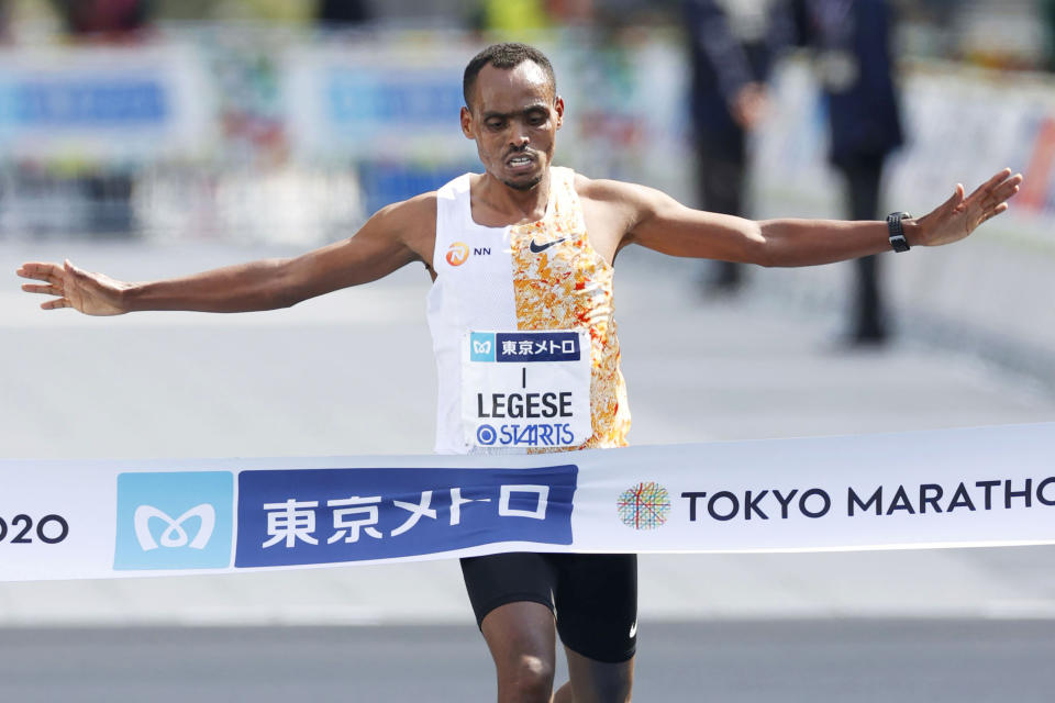Ethiopia's Birhanu Legese crosses the finish line to win the Tokyo Marathon in Tokyo Sunday, March 1, 2020. The race was scaled back as part of Japan's efforts to combat the spread of the coronavirus. (Masanori Takei/Kyodo News via AP)