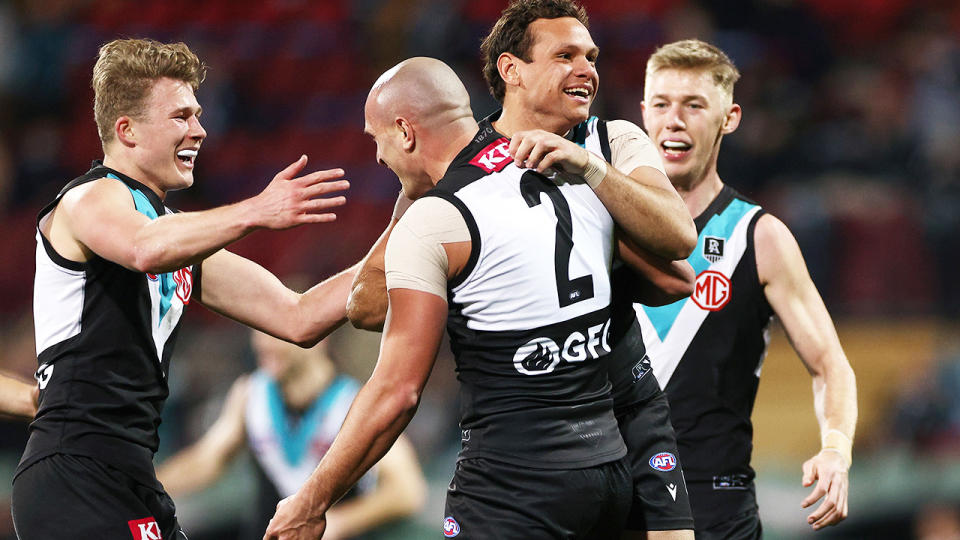 Port Adelaide players, pictured here during their win over Geelong.