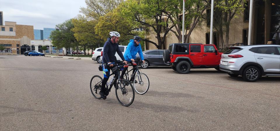 Ken Craft, right, and Rowan Vansleve, the founder and president of Hope the Mission, ride into Amarillo City Hall on Monday afternoon.