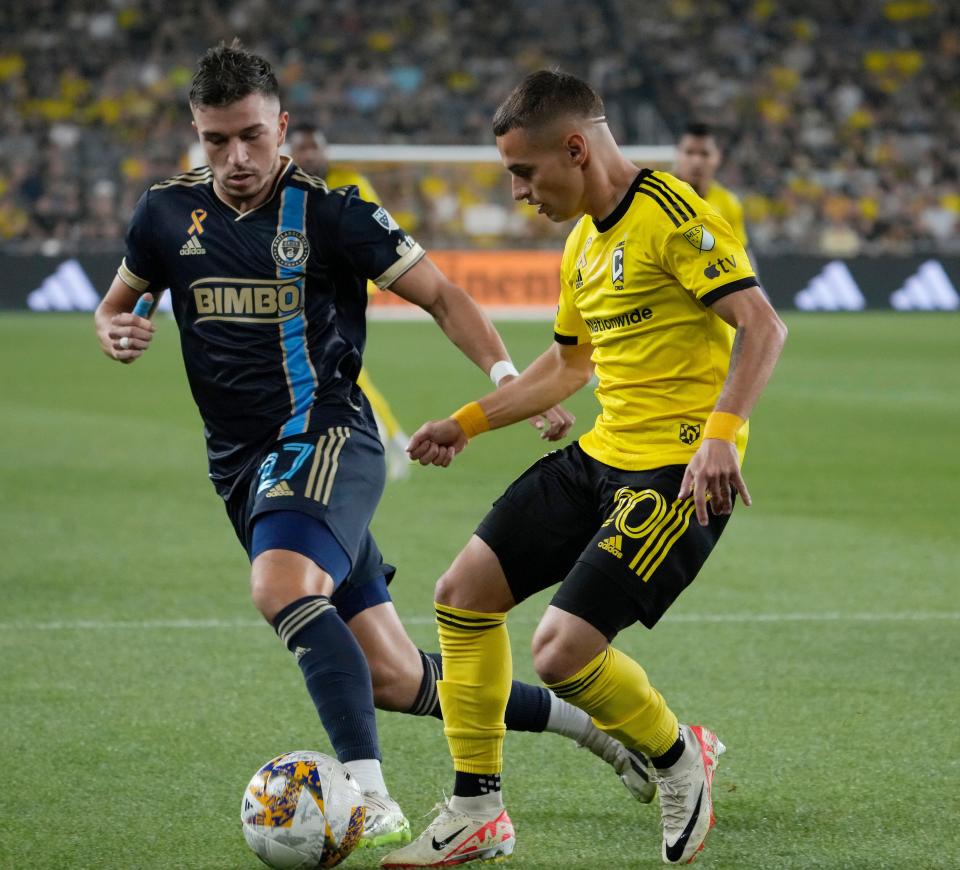 Sept. 30, 2023; Columbus, Oh., USA; 
Columbus Crew forward Diego Rossi (10) is defended by Philadelphia Union defender Kai Wagner (27) during the first half of Saturday's match at Lower.com Field in Columbus.