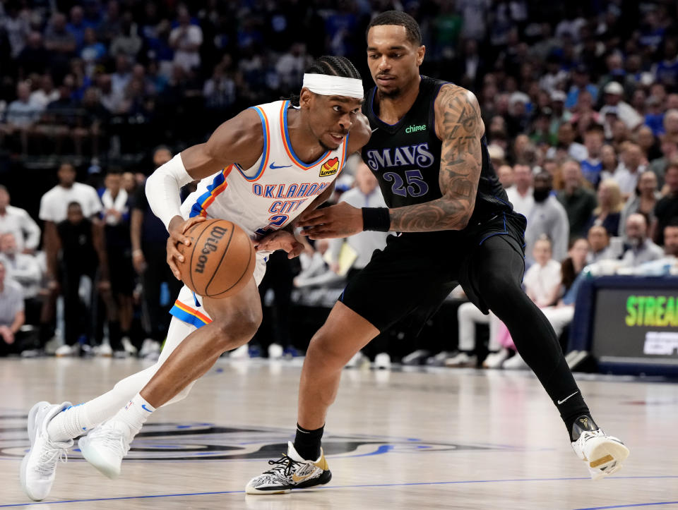 DALLAS, TEXAS - MAY 18: Shai Gilgeous-Alexander #2 of the Oklahoma City Thunder is defended by PJ Washington #25 of the Dallas Mavericks during the second half of Game Six of the Western Conference Second Round Playoffs at the American Airlines Center on the 18 May 2024 in Dallas, Texas.  NOTE TO USER: User expressly acknowledges and agrees that by downloading and/or using this photo, user agrees to the terms and conditions of the Getty Images License Agreement.  (Photo by Sam Hodde/Getty Images)