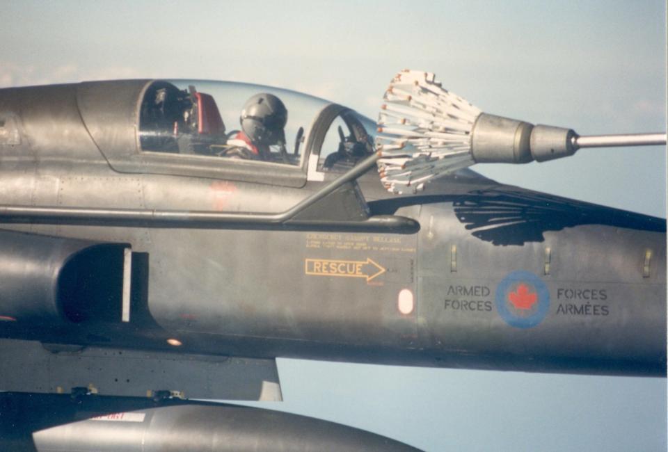 A solo student plugged into the tanker. Note how large the solid steel basket is, and how close it is to the delicate fighter<em>.</em> <em>Dan McWilliams</em>