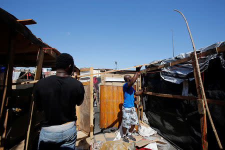 African migrants work on a makeshift house on the outskirts of Casablanca, Morocco September 5, 2018. REUTERS/Youssef Boudlal