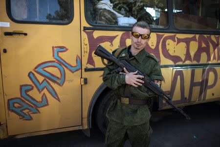 A pro-Russian rebel poses for a picture inside the Vostok (East) battalion base in Donetsk, eastern Ukraine, September 17, 2014. REUTERS/Marko Djurica