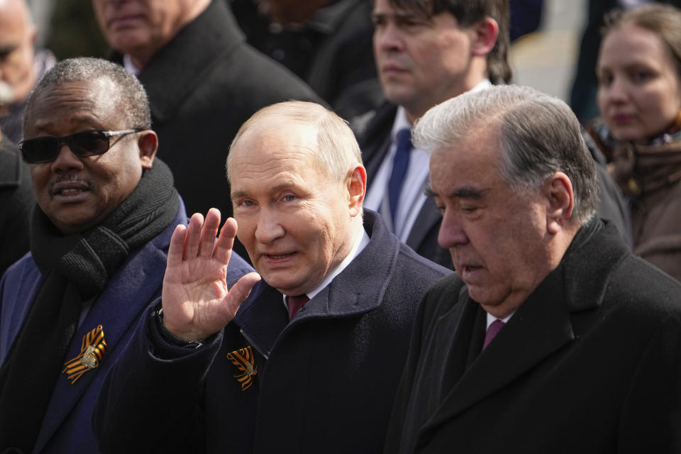 President of the Republic of Tajikistan Emomali Rahmon, right, and Russian President Vladimir Putin, front center, leave Red Square after the Victory Day military parade in Moscow, Russia, Thursday, May 9, 2024, marking the 79th anniversary of the end of World War II. (AP Photo/Alexander Zemlianichenko)