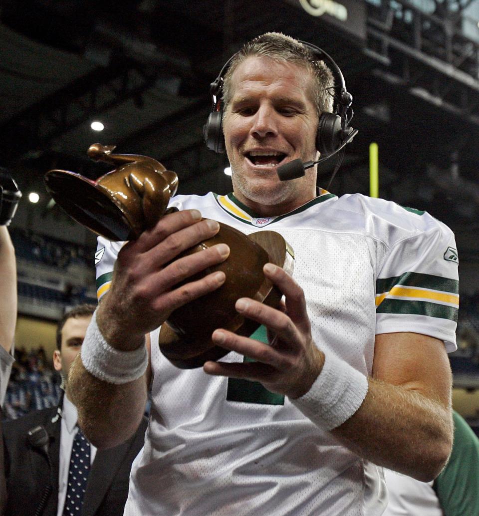 Packers quarterback Brett Favre smiles after getting the turkey-shaped Player of the Game award after the Packers beat the Detroit Lions on Thanksgiving Day Nov. 22, 2007, at Ford Field in Detroit.