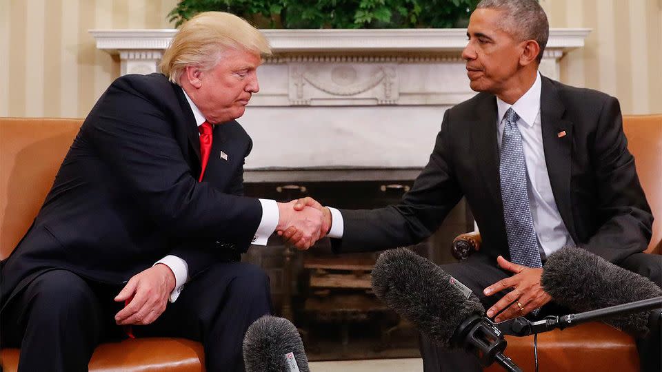 Awkward handshake as Trump and Obama meet face to face for the first time. Photo: AAP