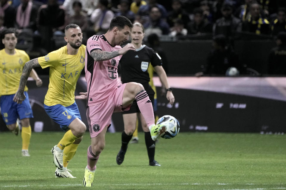 Inter Miami's Lionel Messi controls the ball during the Riyadh Season Cup soccer match between Inter Miami and Al Nassr at Kingdom Arena Stadium in Riyadh, Saudi Arabia, Thursday, Feb. 1, 2024. (AP Photo/Amr Nabil)