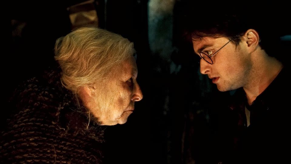 Hazel Douglas as Bathilda Bagshot and Daniel Radcliffe as Harry Potter in "Harry Potter and the Deathly Hallows: Part 1." - Warner Bros./Alamy Stock Photo