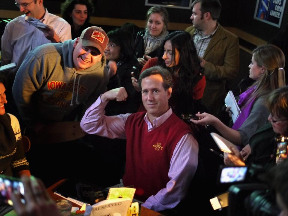 Republican presidential candidate former U.S. Senator Rick Santorum (R-PA) poses for a picture while hosting a Pinstripe Bowl watch party at Buffalo Wild Wings Grill and Bar on December 30, 2011, in Ames, Iowa (Getty Images)