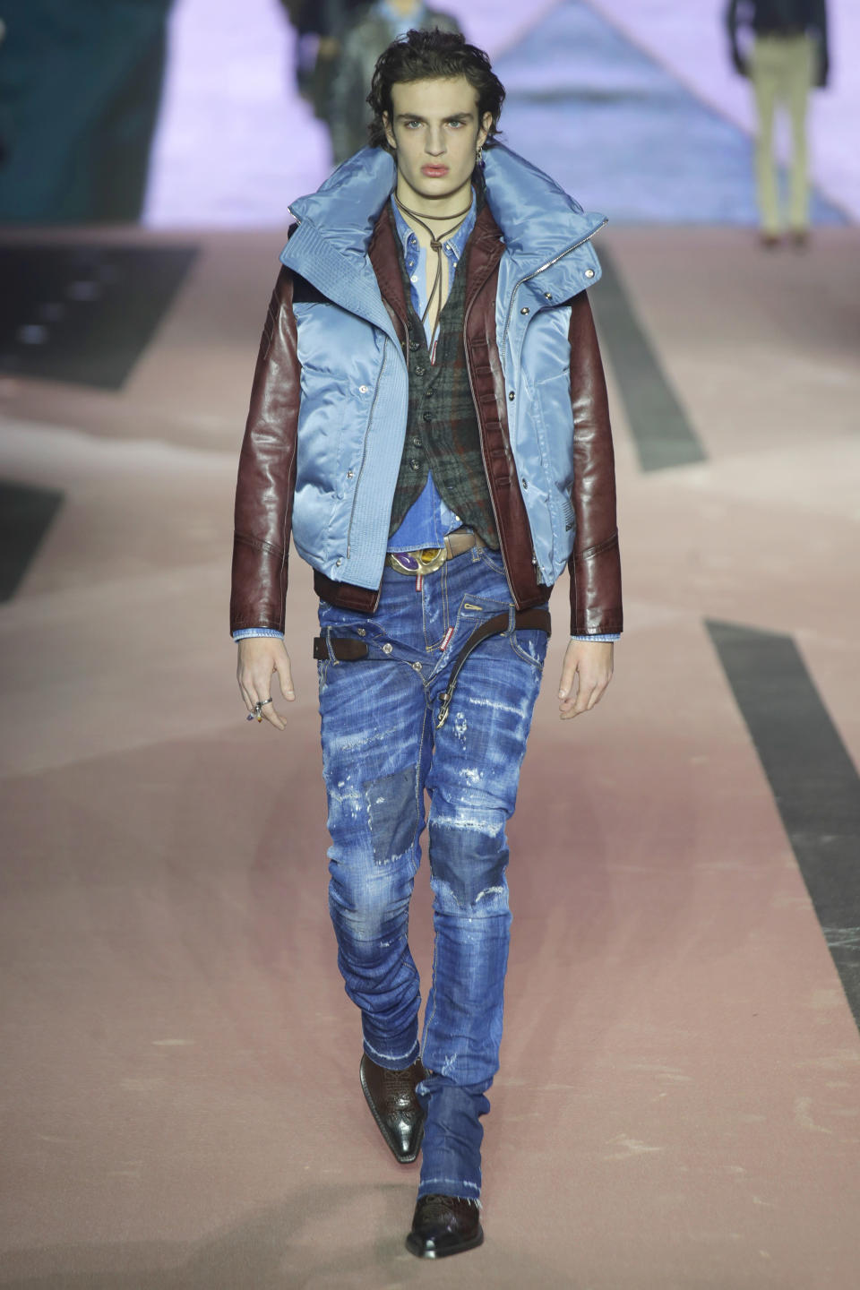 A model wears a creation as part of the Dsquared2 men's Fall-Winter 2020/21 collection, that was presented in Milan, Italy, Friday, Jan. 10, 2019. (AP Photo/Luca Bruno)