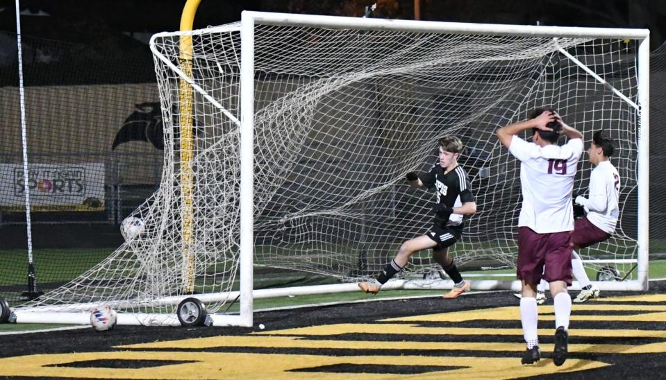 Newbury Park's Isaac Berini scores one of his two goals during the Panthers' 4-0 win over Adelanto in a CIF-SS Division 3 second-round match at Newbury Park High on Friday, Feb. 9, 2024.