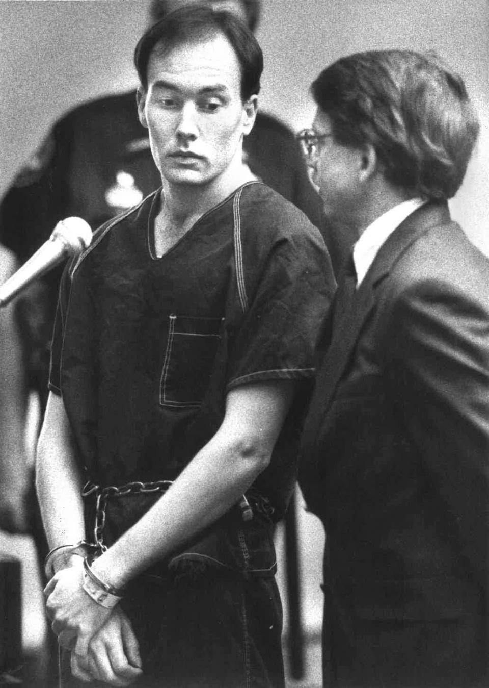 Donald David Dillbeck raises his eyebrows toward his lawyer just after being sentenced to death.