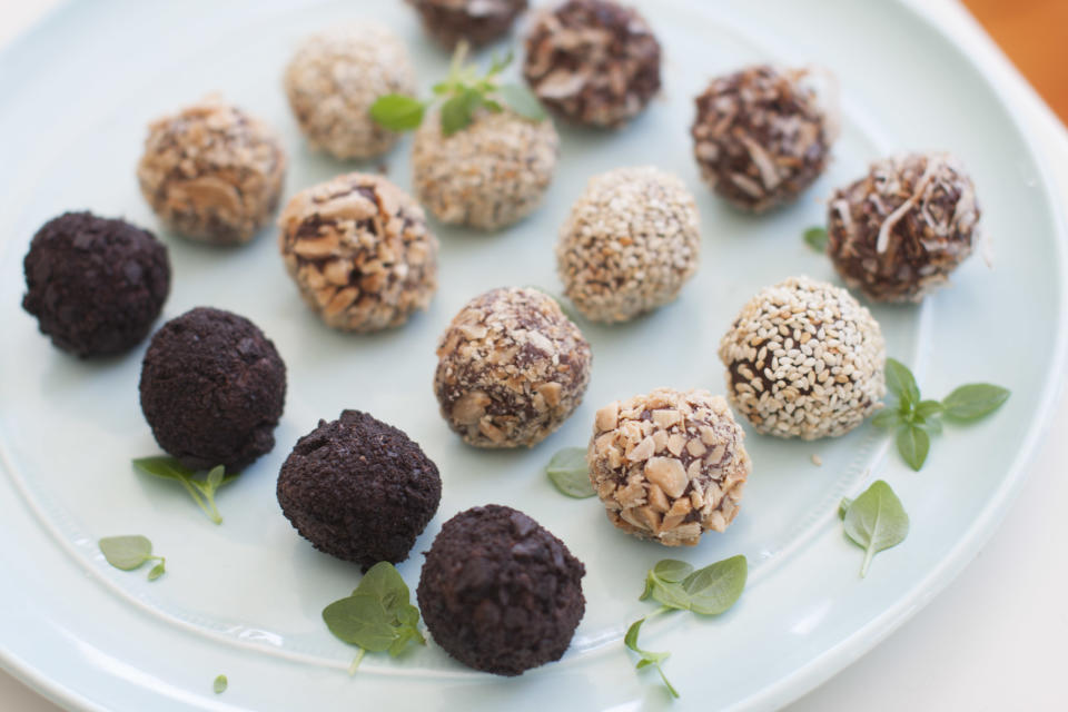 This March 24, 2014 photo shows a variety of basil tea truffles coated with chocolate wafer cookies, chopped marcona almonds, toasted sesame seeds, and toasted coconut, in Concord, N.H. (AP Photo/Matthew Mead)