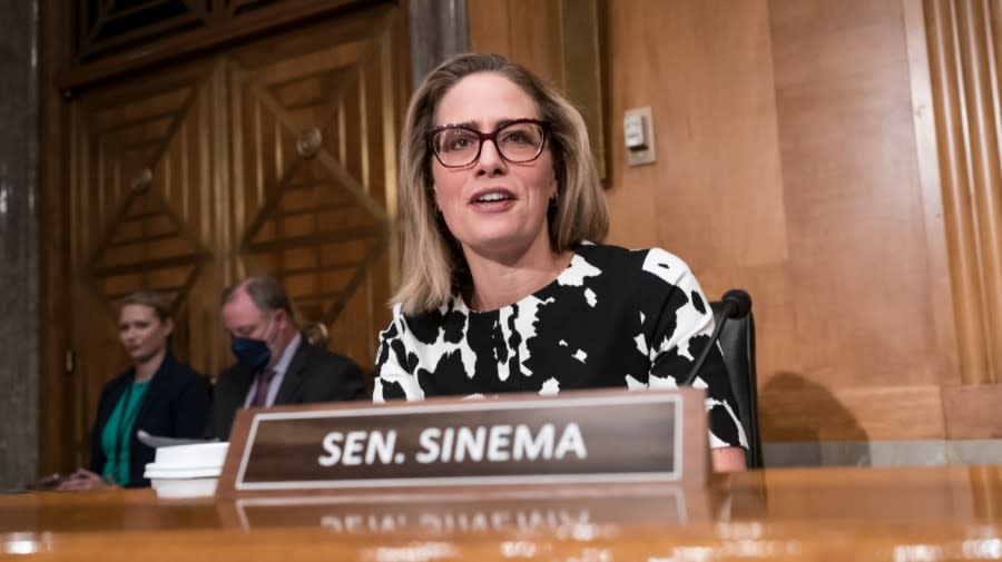 Sen. Kyrsten Sinema, D-Ariz., arrives for a meeting of the Senate Homeland Security Committee at the Capitol in Washington, Wednesday, Aug. 3, 2022.