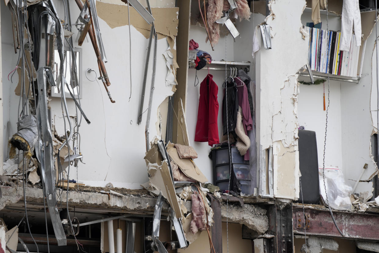 Personal belongs are seen in the remains of a collapsed apartment building, Monday, June 5, 2023, in Davenport, Iowa. The six-story, 80-unit building partially collapsed May 28. (AP Photo/Charlie Neibergall)