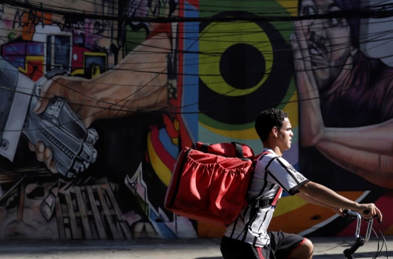 Erik Thiago rides his bicycle, amid the coronavirus disease (COVID-19) outbreak, in Sao Paulo