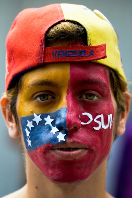 A Venezuelan opposition activist waits to authenticate his signature for a recall referendum before the National Electoral Council (CNE) on the last day, in Caracas, on June 24, 2016