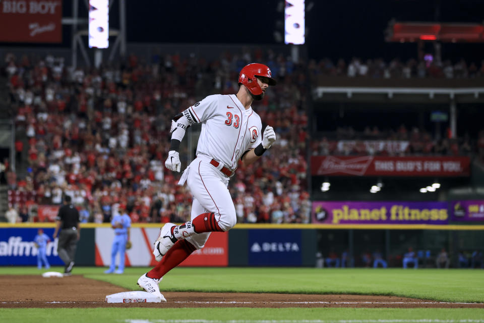 Cincinnati Reds' Jesse Winker runs the bases after hitting a two-run home run during the seventh inning of the team's baseball game against the St. Louis Cardinals in Cincinnati, Saturday, July 24, 2021. (AP Photo/Aaron Doster)