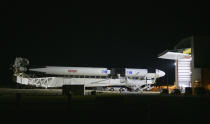 A SpaceX Falcon 9 rocket with the company's Crew Dragon spacecraft is rolled out of the horizontal integration facility at Launch Complex 39A as preparations continue for the Demo-2 mission, Thursday, May 21, 2020, at NASA's Kennedy Space Center in Cape Canaveral, Fla. (Bill Ingalls/NASA via AP)