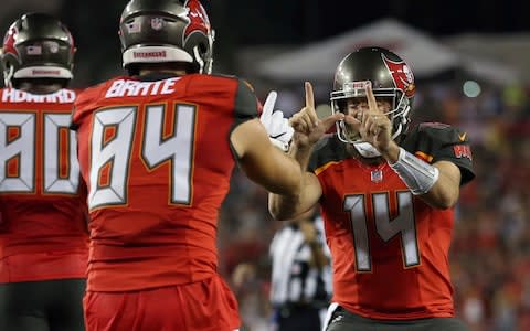 Tampa Bay Buccaneers quarterback Ryan Fitzpatrick (14) celebrates with tight end Cameron Brate (84) after Brate caught a 4-yard touchdown pass against the Pittsburgh Steelers during the first half of an NFL football game Monday, Sept. 24, 2018, in Tampa - Credit: AP