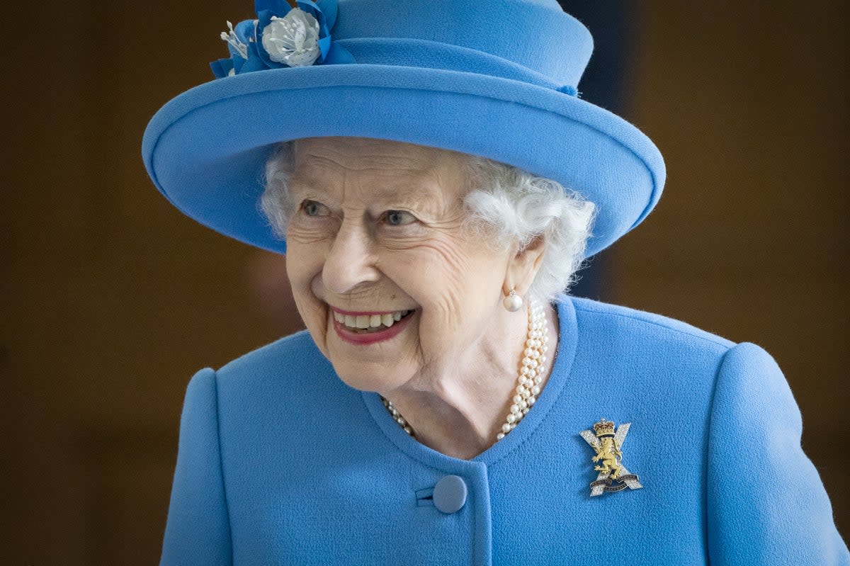 The Queen chose brightly-coloured outfits to ensure she was visible at public appearances (Jane Barlow/PA) (PA Archive)