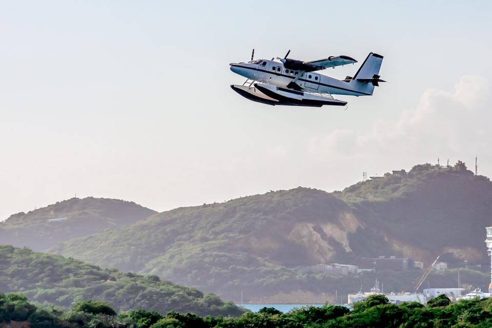 A seaplane flying over Crown Bay, US Virgin Islands