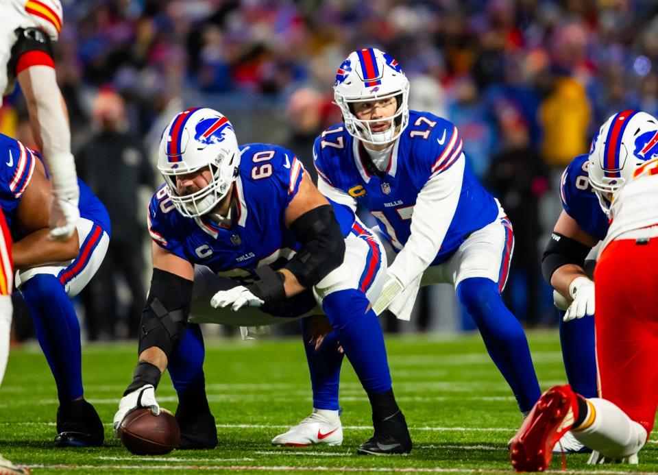 Buffalo Bills center Mitch Morse (60), seen here snapping the ball to quarterback Josh Allen, has reportedly agreed to a two-year, $10 million free agent deal with the Jacksonville Jaguars to stabilize their offensive line.