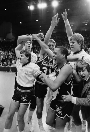 Villanova University players and coaches celebrate 59-55 NCAA tournament victory over Michigan.