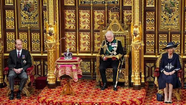 <div class="inline-image__caption"><p>Britain's Prince Charles, Prince of Wales (2nd R) reads the Queen's Speech as he sits by the Imperial State Crown (2nd L), Britain's Camilla, Duchess of Cornwall (R) and Britain's Prince William, Duke of Cambridge (L) in the House of Lords chamber, during the State Opening of Parliament, at the Houses of Parliament, in London, on May 10, 2022.</p></div> <div class="inline-image__credit">ARTHUR EDWARDS/POOL/AFP via Getty Images</div>