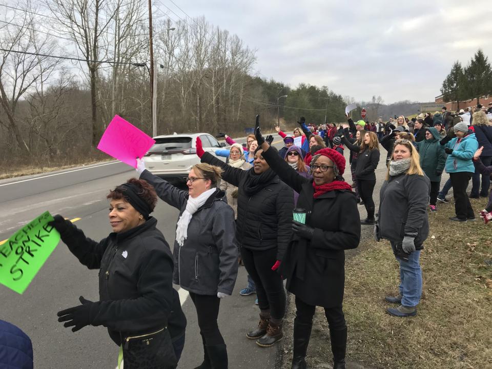 West Virginia teachers gathered at Capital High School in Charleston, WV. early Tuesday, Feb. 19, 2019, morning to protest the Omnibus Bill that is moving through the Legislature. (Kenny Kemp/Charleston Gazette-Mail via AP)