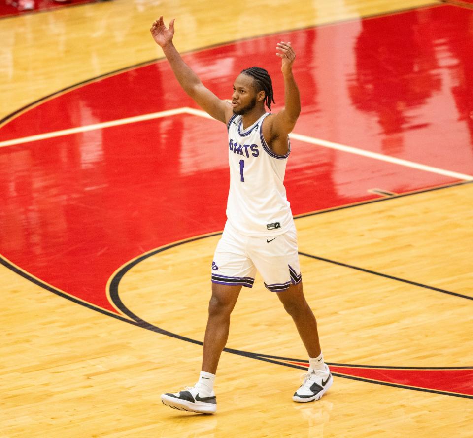 Ben Davis High School senior Mark White (1) reacts as time expires during an IHSAA Class 4A Boys Regional basketball game against New Palestine High School, Saturday, March 9, 2024, at Southport High School. Ben Davis won, 70-59.