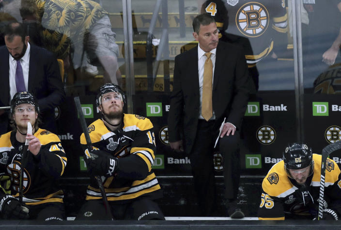 Boston Bruins head coach Bruce Cassidy watches from behind the bench during the first period in Game 7 of the NHL hockey Stanley Cup Final, Wednesday, June 12, 2019, in Boston. (AP Photo/Charles Krupa)