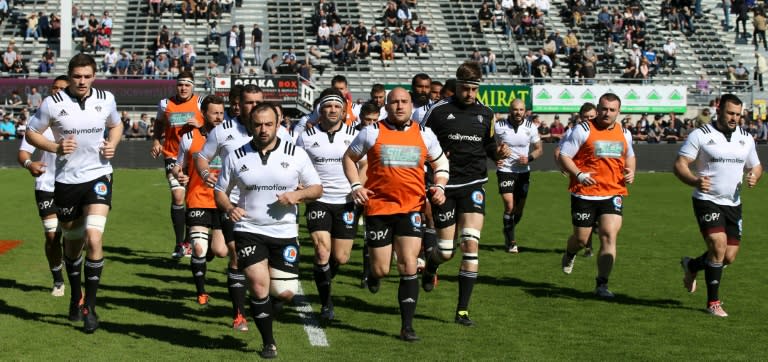 Brive's players warm up before a French Top 14 rugby union match against Montpellier on March 26, 2017