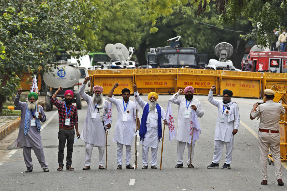 Farmers shout anti government slogans during a protest in New Delhi, India, Thursday, July 22, 2021. More than 200 farmers on Thursday began a protest near India's Parliament to mark eight months of their agitation against new agricultural laws that they say will devastate their income. (AP Photo/Manish Swarup)