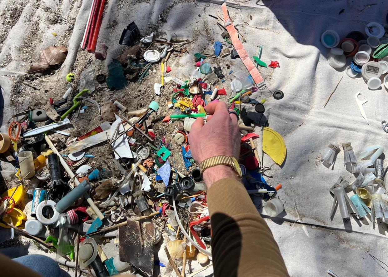 Beach cleanup finds are counted and categorized for research and advocacy efforts.