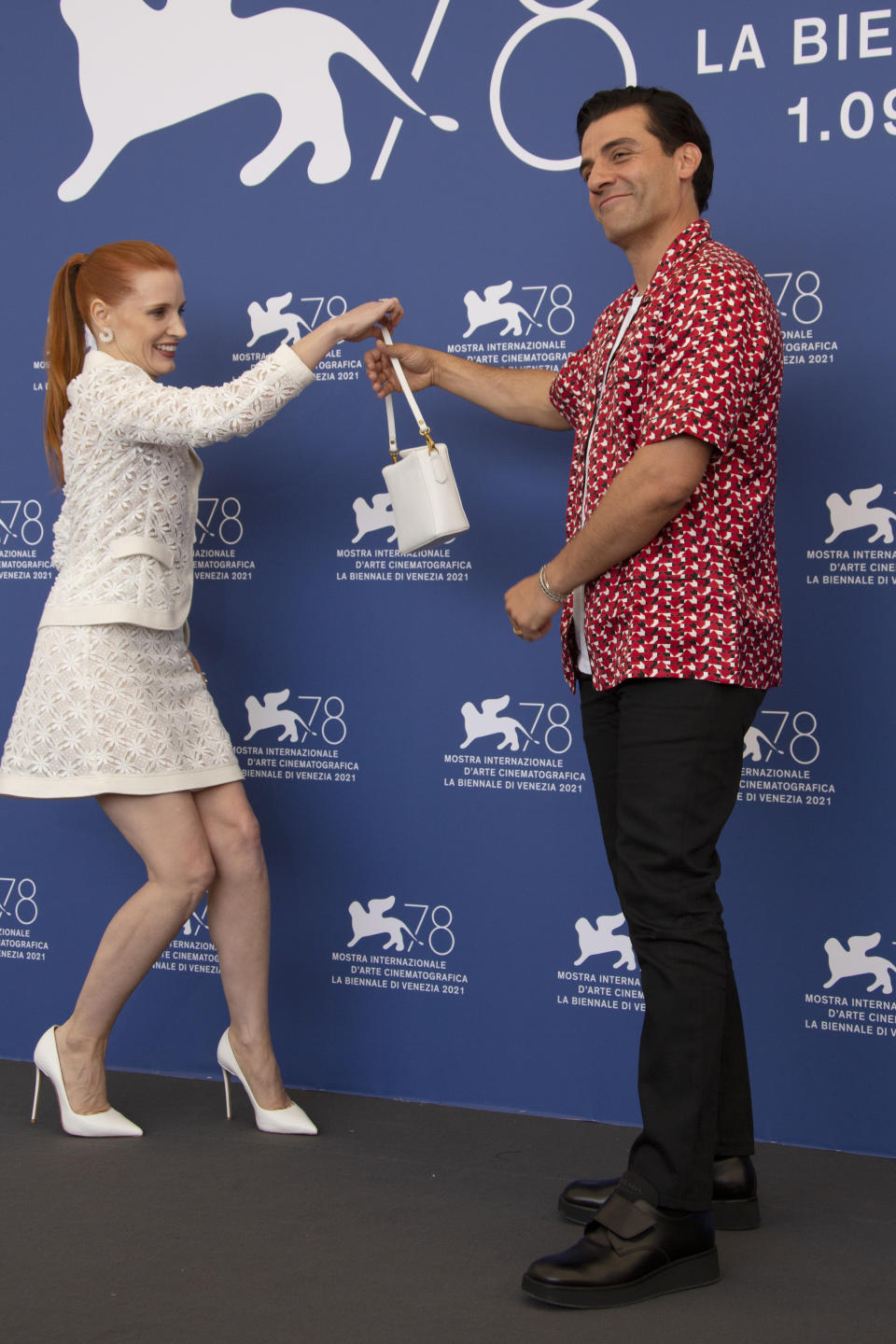 FILE - In this Sept, 4, 2021 file photo Oscar Isaac, right, and Jessica Chastain pose for photographers at the photo call for the film 'Scenes of a Marriage' during the 78th edition of the Venice Film Festival in Venice, Italy. (Photo by Joel C Ryan/Invision/AP, File)