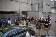 Security personnel guard the main entrance of the Pakistan Stock Exchange building in Karachi on June 29, 2020. - Gunmen attacked the Pakistan Stock Exchange in Karachi on June 29, with four of the assailants killed, police said. (Photo by Asif HASSAN / AFP) (Photo by ASIF HASSAN/AFP via Getty Images)