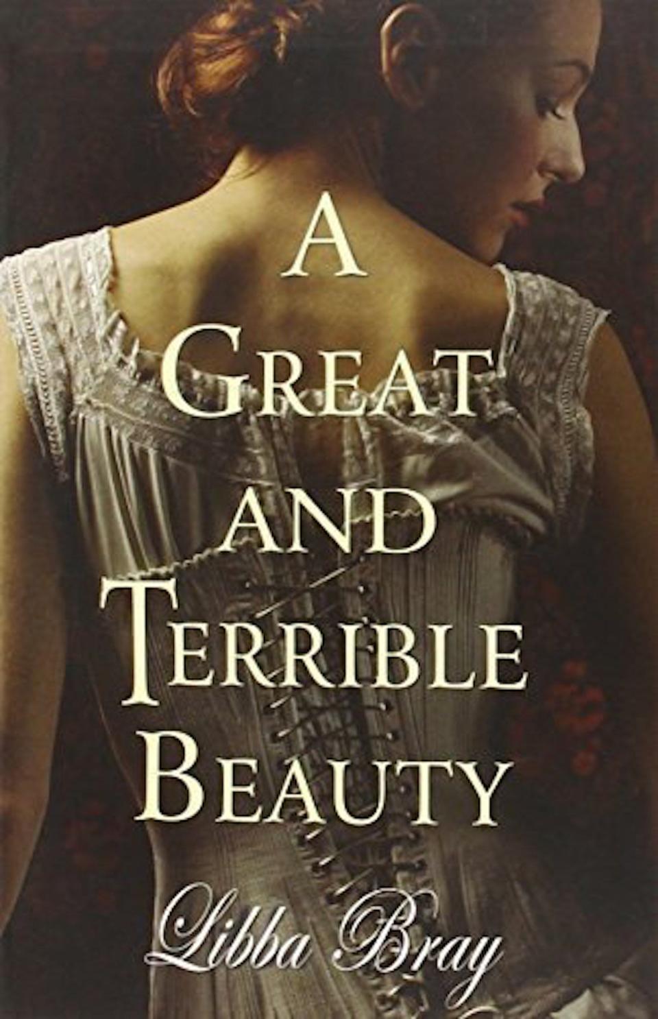 A woman in a white corset with red hair looks over her shoulder with "A Great And Terrible Beauty" written over it.